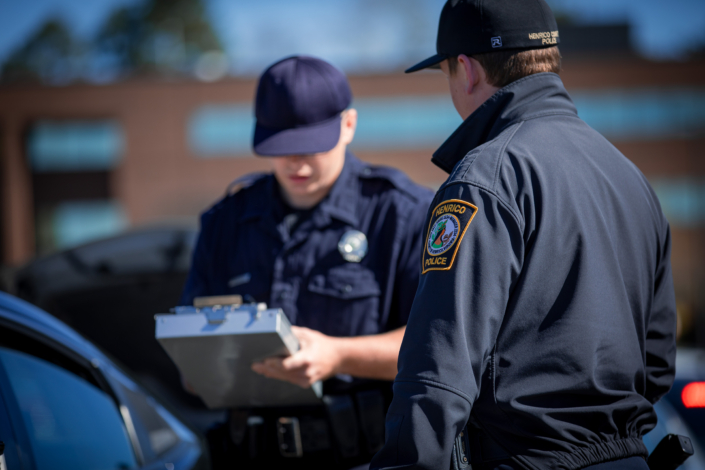 Henrico Police recruit taking crash investigation notes.