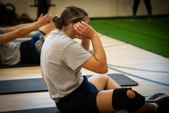 Henrico Police Recruit does a sit-up during physical fitness training